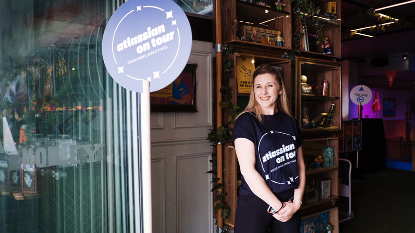 An Atlassian team member at an "Atlassian On Tour" event