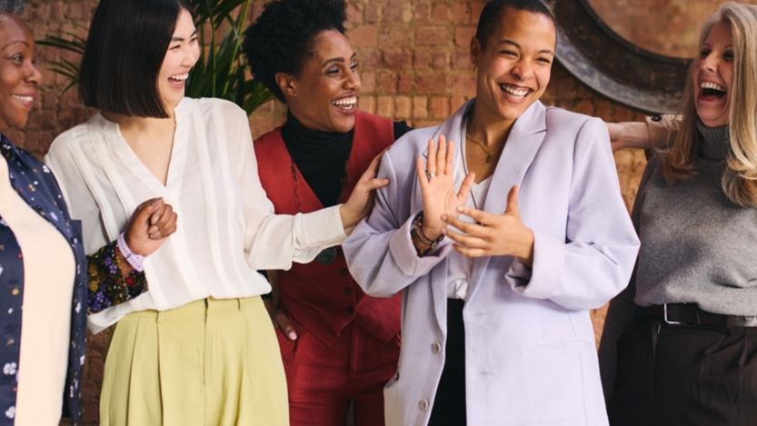 A group of women smiling.